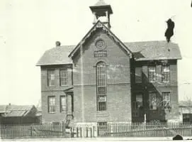 This is the very first St. Joseph School building, built in 1890. Four of the nuns lived in the school basement until the upper part of the school was remodeled for their living quarters. It had four rooms and a basement.